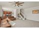 Spacious living room with hardwood floors and a view of the kitchen and staircase at 385 N Flat Rock St, Aurora, CO 80018