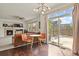 Casual dining area with view of backyard and kitchen at 385 N Flat Rock St, Aurora, CO 80018