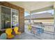 Covered porch with seating area and view of the backyard at 385 N Flat Rock St, Aurora, CO 80018