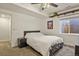 Basement bedroom with queen bed and ceiling fan at 385 N Flat Rock St, Aurora, CO 80018
