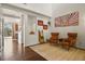 Open concept living room with hardwood floors and view into kitchen at 385 N Flat Rock St, Aurora, CO 80018