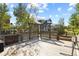 Spacious backyard deck with a wooden pergola and landscaping at 385 N Flat Rock St, Aurora, CO 80018
