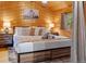 King-size bed with wood details at 224 E Bakerville Rd, Idaho Springs, CO 80452