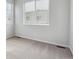 Simple bedroom with neutral wall paint and carpet flooring at 455 Interlocken Blvd # 101, Broomfield, CO 80021