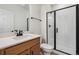 Bathroom with single vanity, shower, and tile flooring at 3184 Boral Owl Dr, Brighton, CO 80601