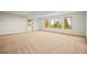 Finished basement with carpet and access to exterior at 10333 Georgia Cir, Morrison, CO 80465