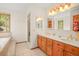 Bathroom with double vanity, soaking tub and shower at 10333 Georgia Cir, Morrison, CO 80465