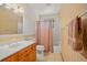 Full bathroom with tub shower, toilet and vanity at 10333 Georgia Cir, Morrison, CO 80465