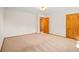 Bright bedroom featuring wood doors and ample space at 10333 Georgia Cir, Morrison, CO 80465