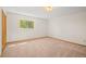 Spacious bedroom with neutral carpeting and large window at 10333 Georgia Cir, Morrison, CO 80465