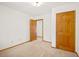 Spacious bedroom with two doors and carpeted floor at 10333 Georgia Cir, Morrison, CO 80465