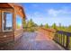 Deck with wooden railings offering mountain views at 10333 Georgia Cir, Morrison, CO 80465
