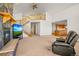 Open concept living room with fireplace and staircase at 10333 Georgia Cir, Morrison, CO 80465