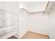 Large walk-in closet with shelving and hanging rods at 10333 Georgia Cir, Morrison, CO 80465