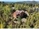 Two-story home nestled in a wooded area with mountain views at 10333 Georgia Cir, Morrison, CO 80465