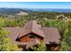 Shingled roof and wood exterior of home with mountain views at 10333 Georgia Cir, Morrison, CO 80465