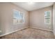 Cozy bedroom with carpeted flooring and large windows at 26550 E Euclid Pl, Aurora, CO 80016