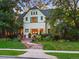 Two-story house with a charming front porch and landscaping at 141 N Gilpin St, Denver, CO 80218