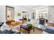 Bright living room featuring hardwood floors and ample natural light at 141 N Gilpin St, Denver, CO 80218