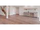 Finished basement featuring hardwood floors and a wet bar at 6812 Carr St, Arvada, CO 80004