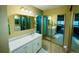 Bathroom with double vanity and mirrored cabinet at 13661 E Marina Dr # 406, Aurora, CO 80014