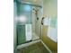 Shower stall with glass door and tiled walls at 13661 E Marina Dr # 406, Aurora, CO 80014