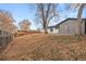 Backyard with exposed earth and leaf-covered ground at 129 W 81St Pl, Denver, CO 80221