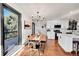 Kitchen dining area with wood table and access to a deck at 8959 Hillview Rd, Morrison, CO 80465