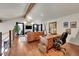 Home office with a view, featuring a large desk and leather couch at 8959 Hillview Rd, Morrison, CO 80465