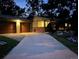 Evening view of house exterior, highlighting the two-car garage and driveway at 1355 Claremont Dr, Boulder, CO 80305