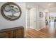 Bright hallway with wood floors and decorative wall art at 1699 N Downing St # 302, Denver, CO 80218