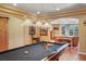 Basement game room with a pool table and access to a secondary sitting area at 4517 Tallyrand Cir, Castle Rock, CO 80104
