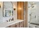 Elegant bathroom with a walk-in shower, modern vanity, and ample storage at 4517 Tallyrand Cir, Castle Rock, CO 80104