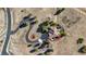 Bird's eye view of a house with a curved driveway and surrounding landscape at 4517 Tallyrand Cir, Castle Rock, CO 80104