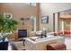 Spacious living room with a fireplace and large windows offering natural light at 4517 Tallyrand Cir, Castle Rock, CO 80104
