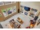 Spacious living room with a fireplace and large windows overlooking a patio at 4517 Tallyrand Cir, Castle Rock, CO 80104