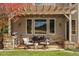 Outdoor patio with pergola, built-in grill, and dining area at 4517 Tallyrand Cir, Castle Rock, CO 80104