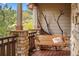 Relaxing wooden porch swing overlooking scenic wooded area at 4517 Tallyrand Cir, Castle Rock, CO 80104