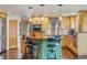 Spacious kitchen with an island and stainless steel appliances at 4517 Tallyrand Cir, Castle Rock, CO 80104
