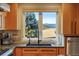 Kitchen sink with mountain views from the window at 4517 Tallyrand Cir, Castle Rock, CO 80104