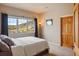 Spacious bedroom with a large window and mountain views at 4517 Tallyrand Cir, Castle Rock, CO 80104