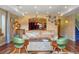 Open concept basement with a leather couch and wood coffee table at 4517 Tallyrand Cir, Castle Rock, CO 80104