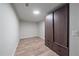 Finished basement room with laminate flooring and closet at 1827 Quail St # 3, Lakewood, CO 80215