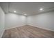 Finished basement with laminate wood flooring at 1827 Quail St # 3, Lakewood, CO 80215
