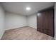 Finished basement room with laminate flooring and closet at 1827 Quail St # 3, Lakewood, CO 80215
