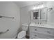 Updated bathroom with white vanity and modern fixtures at 1827 Quail St # 3, Lakewood, CO 80215