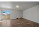 Bright bedroom with wood-look flooring and access to balcony at 1827 Quail St # 3, Lakewood, CO 80215