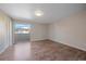 Bright bedroom featuring wood flooring and sliding door to balcony at 1827 Quail St # 3, Lakewood, CO 80215