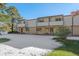 Front view of a townhome with snow-covered yard at 1827 Quail St # 3, Lakewood, CO 80215
