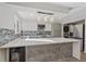 Updated kitchen with stainless steel appliances and white shaker cabinets at 1827 Quail St # 3, Lakewood, CO 80215